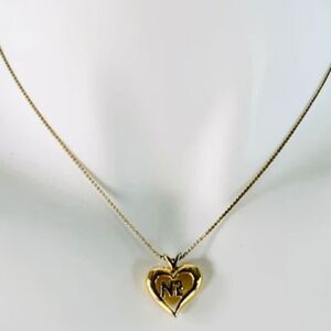 Nina Ricci gold-tone heart pendant necklace.